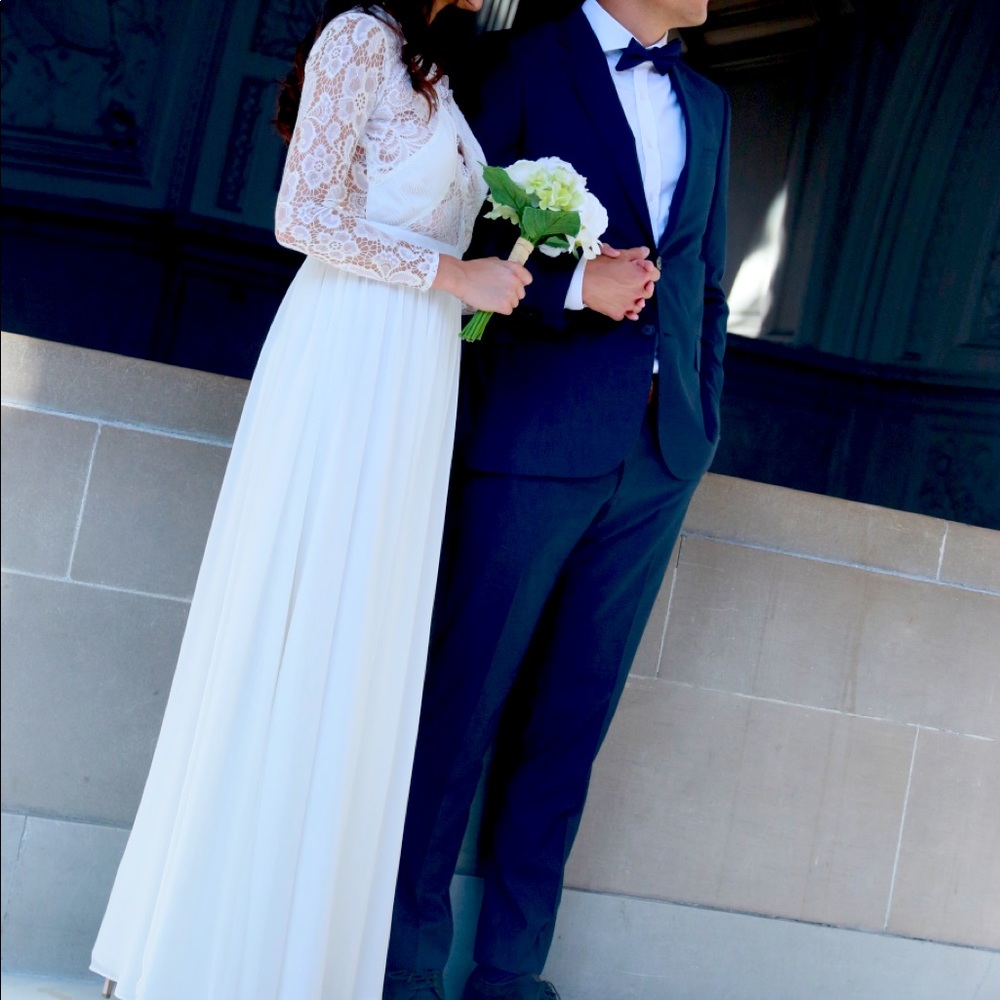White lace long sleeve wedding dress with open back